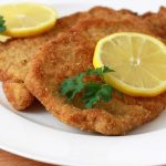 Schnitzel is a popular German dish, made of a thin, boneless cutlet of meat coated in breadcrumbs