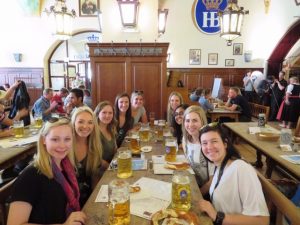 students drinking beer while studying abroad in europe