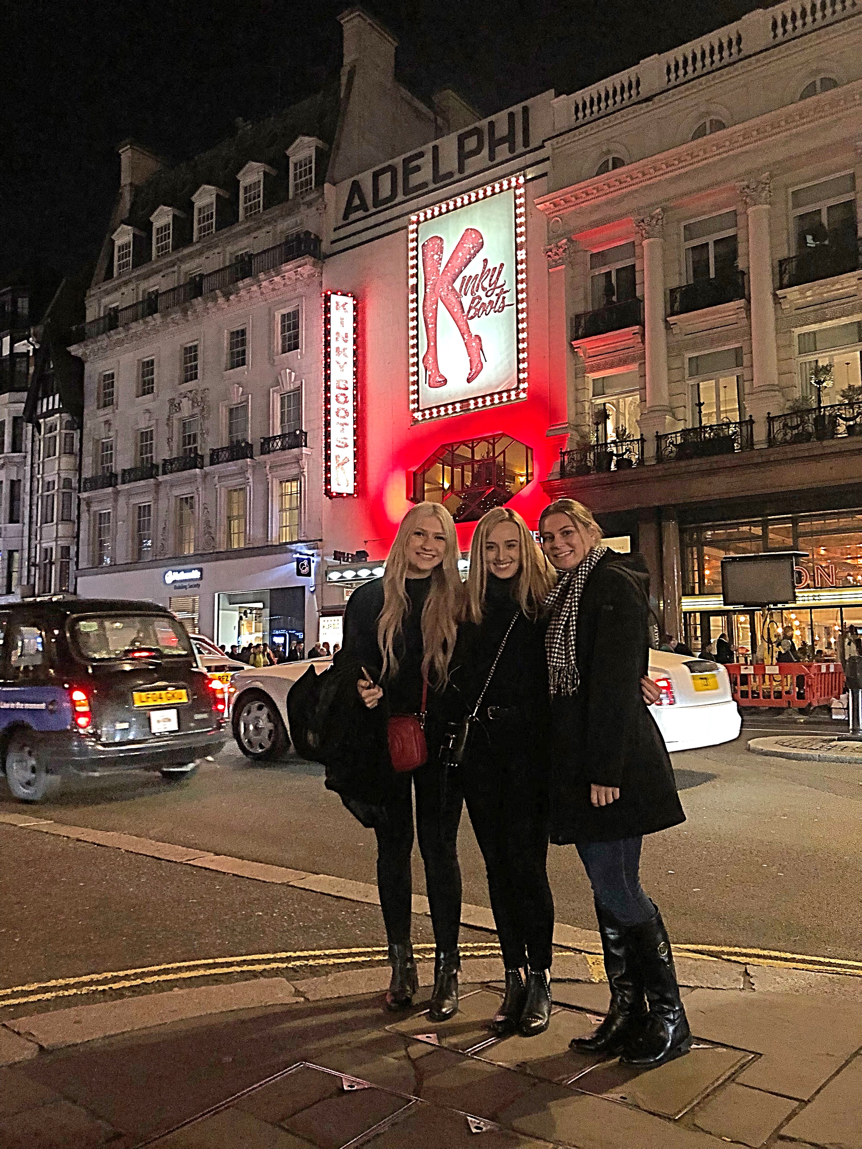 the girls outside a theater showing kinky boots