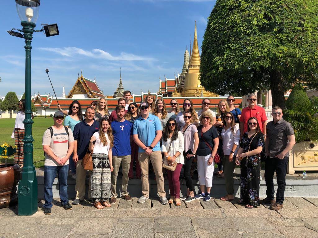 group of students in front of temple in Thailand