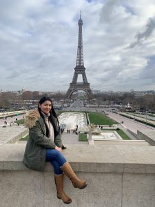 student posing in front of the Eiffel Tower in Paris