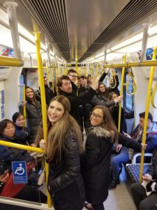 Students riding the Tube in London