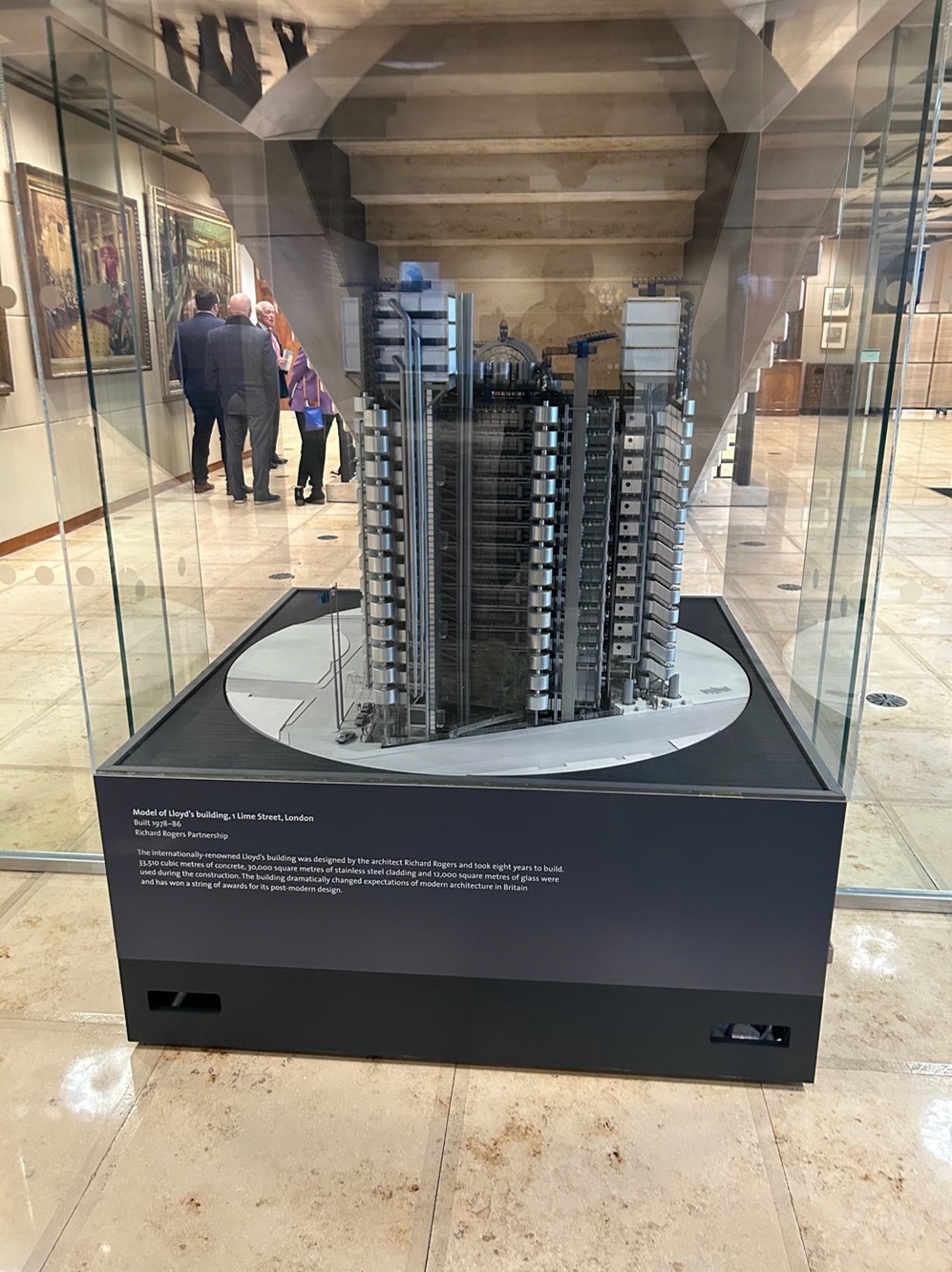 Photo of a scale model of the Lloyds of London building in a display case.